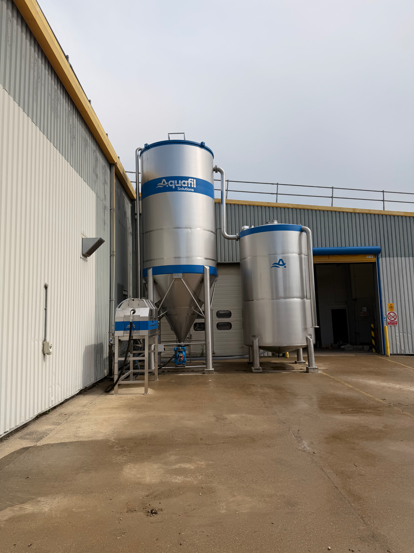 Aquafil CF1500 water treatment system with silos installed at Stone & Ceramic
