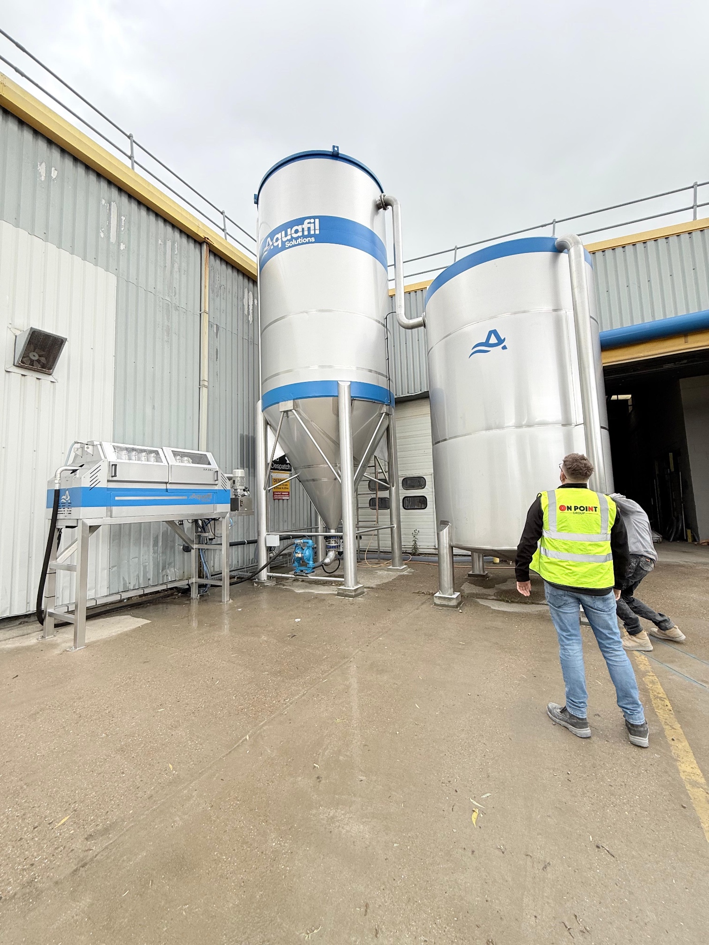 Aquafil silos and filter press installed at a customer site, showing the full height from top to bottom